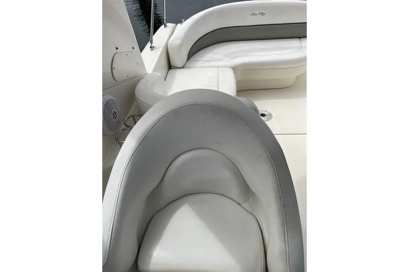 Slide: The Image of 2006 Sea Ray 260 Sundancer boat interior with white leather seating. - 12