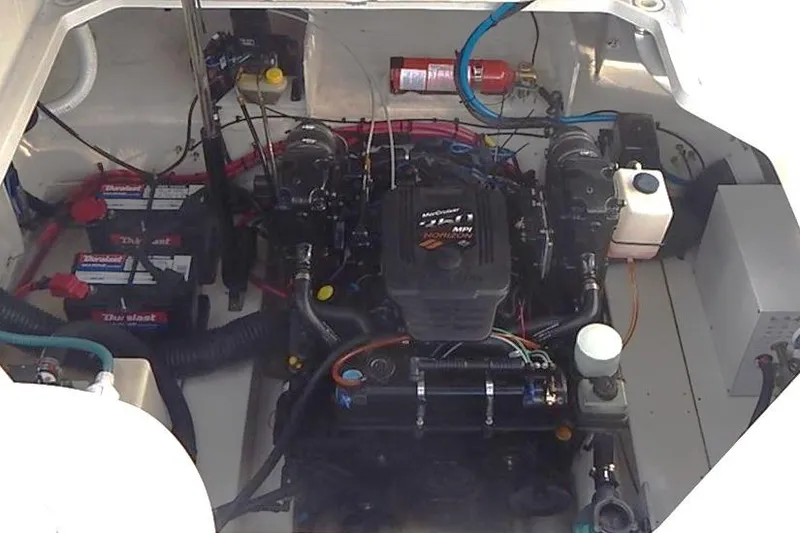 Slide: The Image of Engine compartment of 2006 Sea Ray 260 Sundancer with batteries and fire extinguisher. - 27