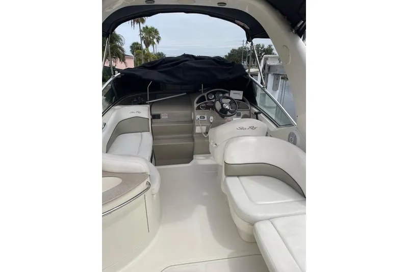 Slide: The Image of 2006 Sea Ray 260 Sundancer boat interior with helm and seating area. - 7