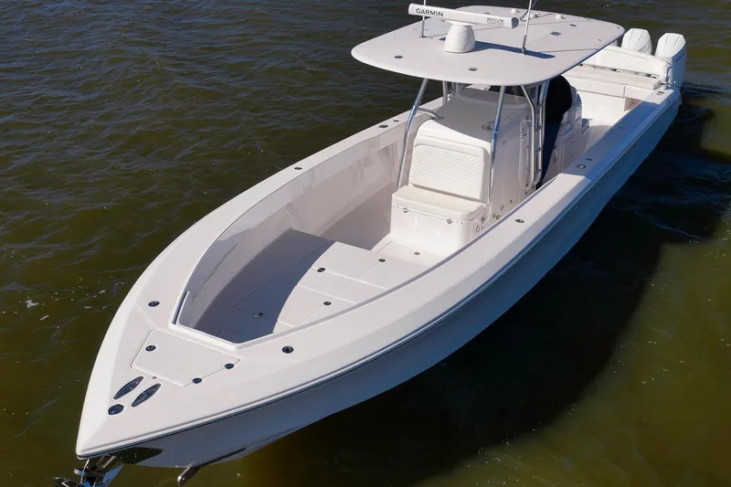 Slide: The Image of 2024 Bahama 41 RD boat on water, showcasing sleek design and spacious deck. - 30