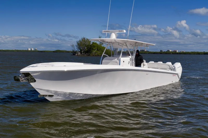 Slide: The Image of 2024 Bahama 41 RD boat cruising on a sunny day with clear skies. - 26