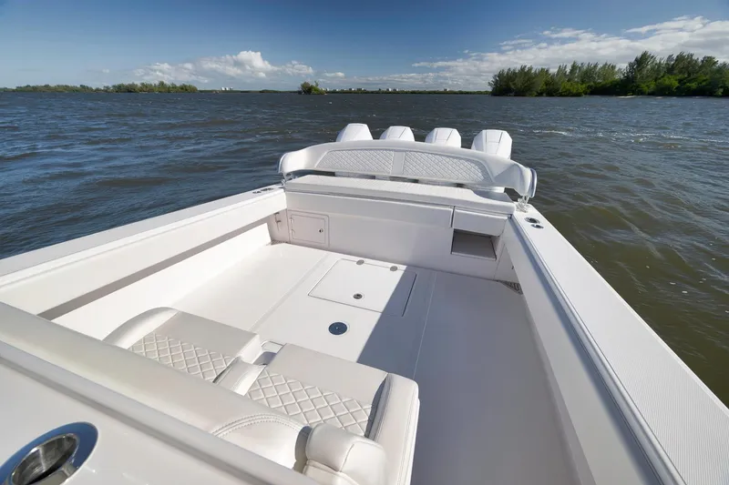 Slide: The Image of 2024 Bahama 41 RD boat on water, showcasing sleek design and spacious deck. - 18
