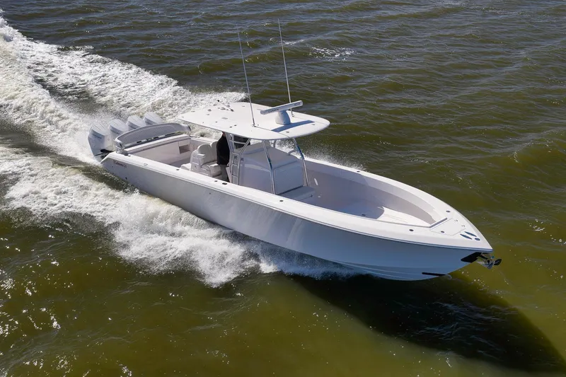 Slide: The Image of 2024 Bahama 41 RD boat cruising on open water, showcasing sleek design and powerful engines. - 27