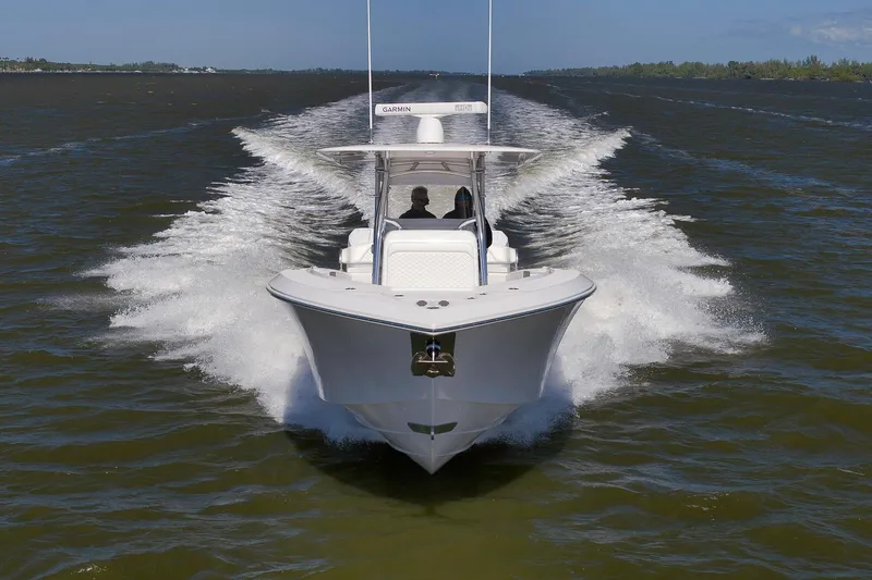 Slide: The Image of 2024 Bahama 41 RD boat cruising on open water, creating a dynamic wake. - 28