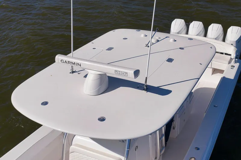 Slide: The Image of 2024 Bahama 41 RD boat with Garmin radar on calm water. - 14