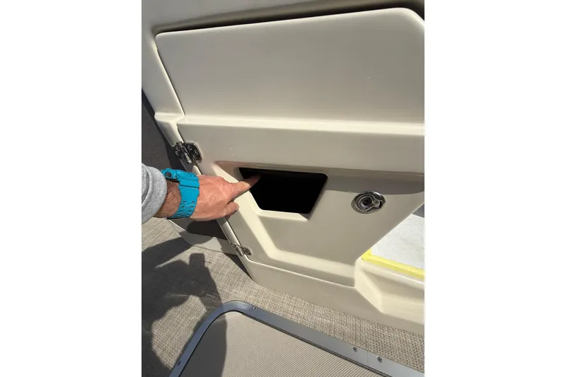 Slide: The Image of Hand opening compartment on Alera M23 boat, 2026 model. - 10