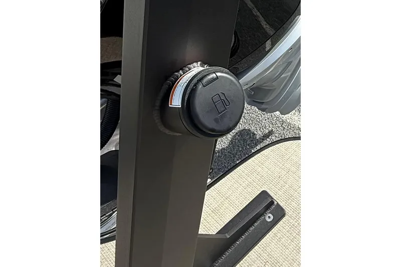 Slide: The Image of Fuel cap of Alera M23, 2026 model, on a vehicle's exterior. - 18