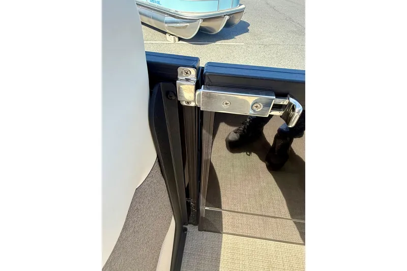 Slide: The Image of Alera M23 2026 boat door latch with reflective surface and secure locking mechanism. - 19