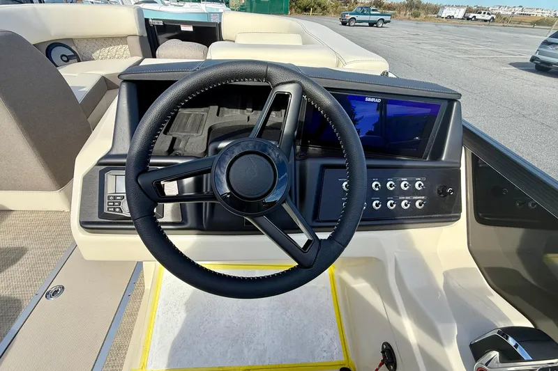 Slide: The Image of Steering wheel and dashboard of 2026 Alera M23 boat, featuring modern controls and display. - 4