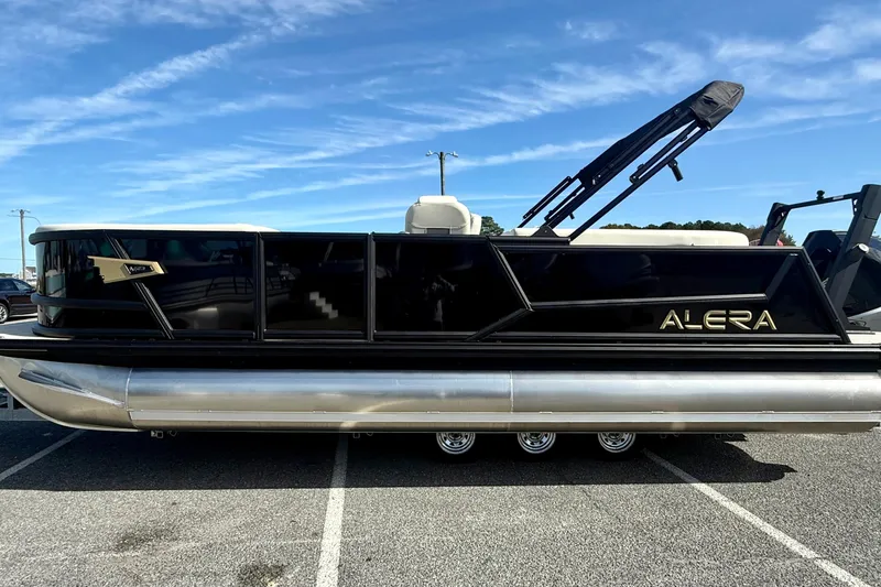 Slide: The Image of Alera M23 2026 pontoon boat parked under a clear blue sky. - 5