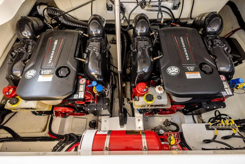 Slide: The Image of Twin Volvo Penta V8 engines in a 2023 Cobalt R33 boat engine compartment. - 29