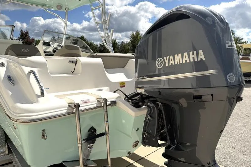 Slide: The Image of 2024 Key West 239 DFS boat with Yamaha outboard motor, sunny day, clear sky. - 11
