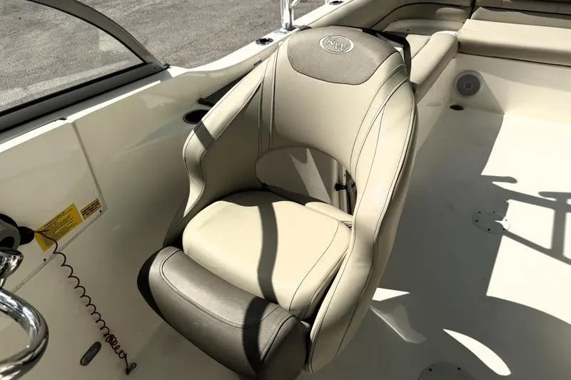 Slide: The Image of 2024 Key West 239 DFS boat interior with beige and gray seating. - 18