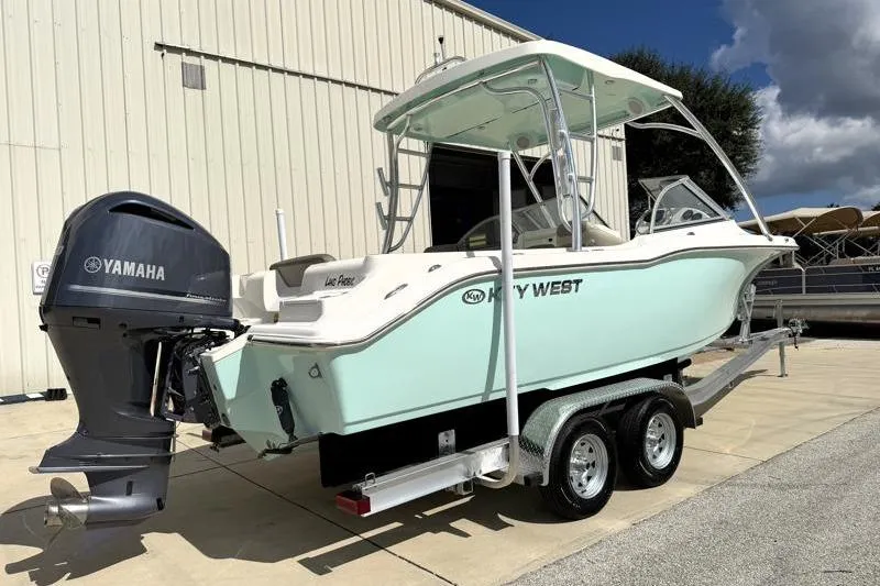 Slide: The Image of 2024 Key West 239 DFS boat on trailer with Yamaha outboard motor. - 2