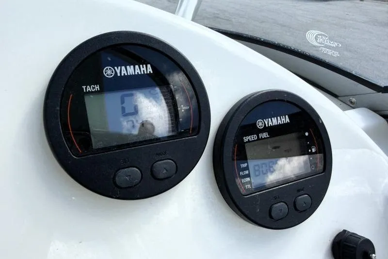Slide: The Image of Yamaha tachometer and speed fuel gauges on 2024 Key West 239 DFS boat dashboard. - 21