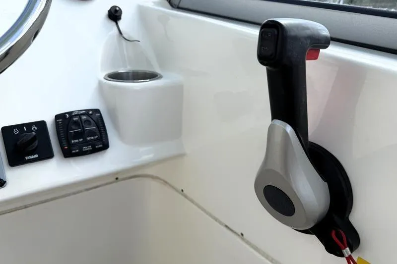 Slide: The Image of 2024 Key West 239 DFS boat controls with throttle and switches. - 23