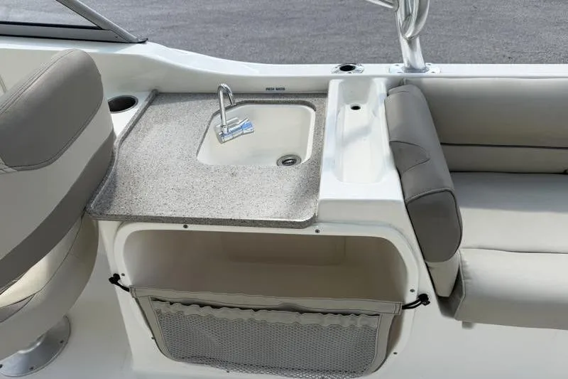 Slide: The Image of 2024 Key West 239 DFS boat interior with sink and seating area. - 31