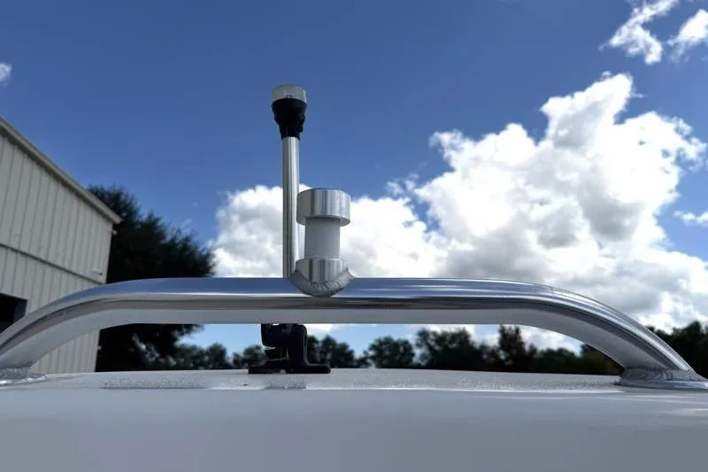 Slide: The Image of 2024 Key West 239 DFS boat detail against a cloudy sky background. - 37