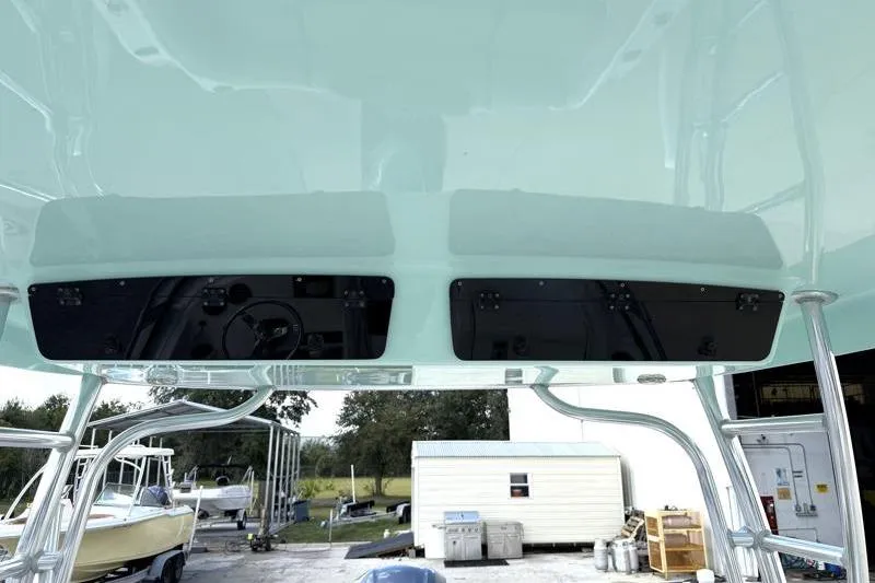 Slide: The Image of 2024 Key West 239 DFS boat interior with overhead storage compartments. - 38