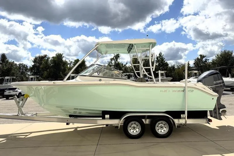 Slide: The Image of 2024 Key West 239 DFS boat on trailer under cloudy sky. - 4