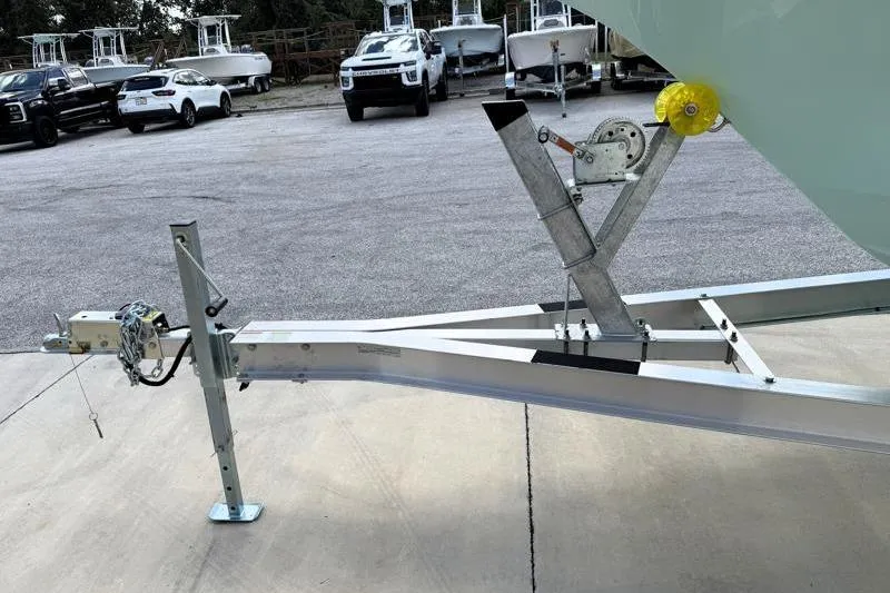 Slide: The Image of 2024 Key West 239 DFS boat trailer hitch and winch in parking lot. - 41