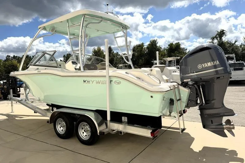 Slide: The Image of 2024 Key West 239 DFS boat on trailer with Yamaha outboard motor. - 5