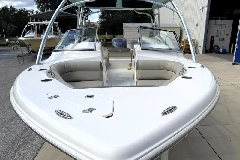 Slide: The Image of 2024 Key West 239 DFS boat with open bow seating and sleek design. - 6