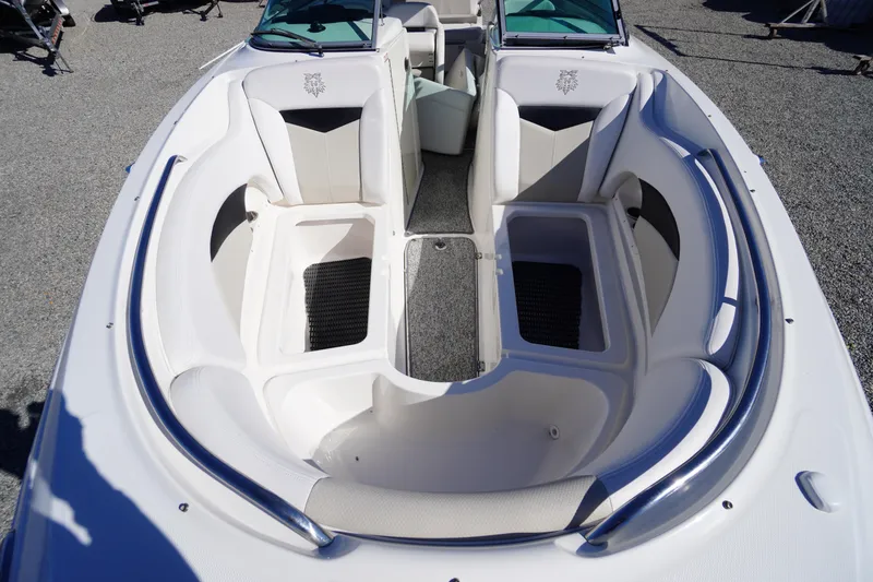 Slide: The Image of 2014 Chaparral 287 SSX boat interior with spacious seating and storage compartments. - 10