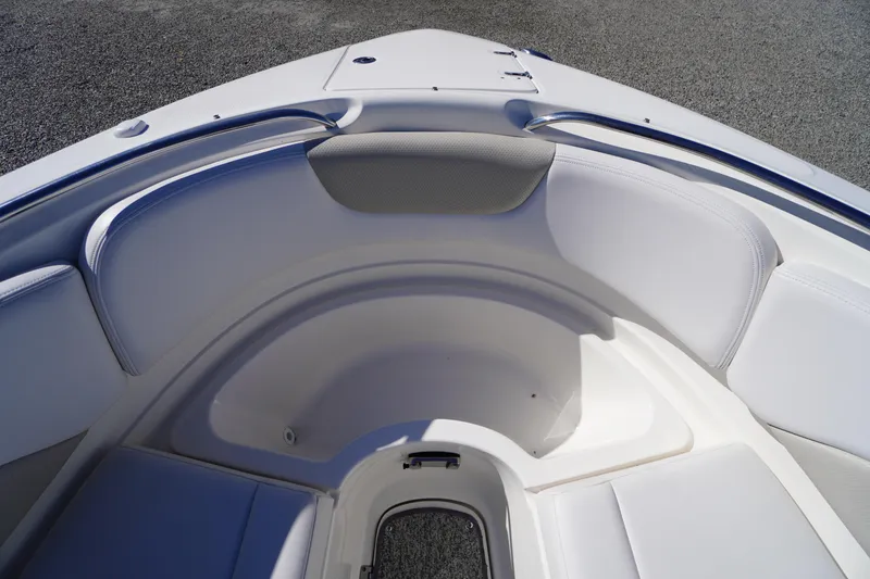 Slide: The Image of 2014 Chaparral 287 SSX boat interior with white cushioned seating. - 11