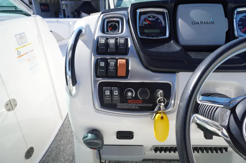 Slide: The Image of Dashboard of a 2014 Chaparral 287 SSX boat with Garmin navigation system. - 18