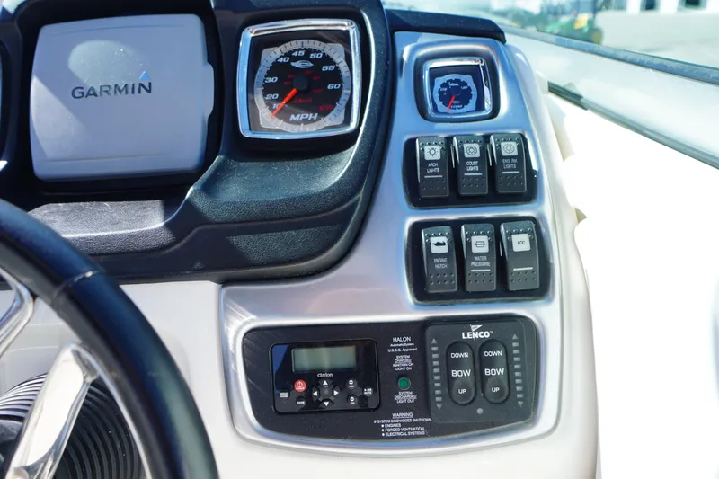 Slide: The Image of Dashboard of 2014 Chaparral 287 SSX boat with Garmin GPS and control switches. - 19