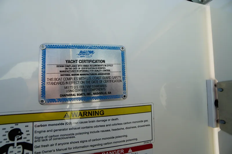 Slide: The Image of 2014 Chaparral 287 SSX yacht certification and safety warning labels. - 21