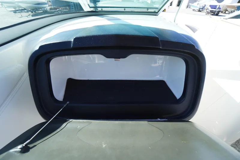 Slide: The Image of Open storage compartment on a 2014 Chaparral 287 SSX boat. - 27