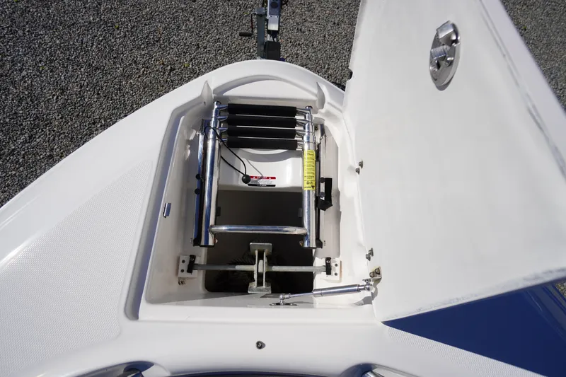 Slide: The Image of 2014 Chaparral 287 SSX boat with open anchor locker and ladder. - 3