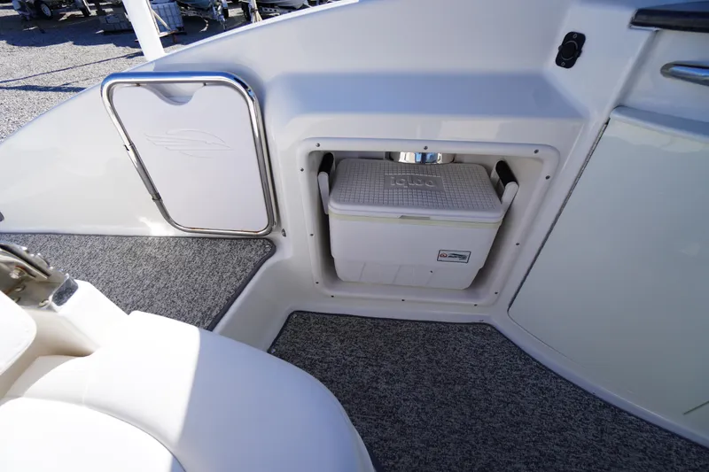 Slide: The Image of 2014 Chaparral 287 SSX boat interior with built-in Igloo cooler storage. - 31