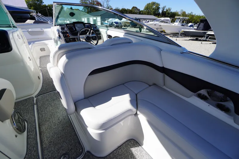 Slide: The Image of Interior of a 2014 Chaparral 287 SSX boat with plush seating and modern dashboard. - 36