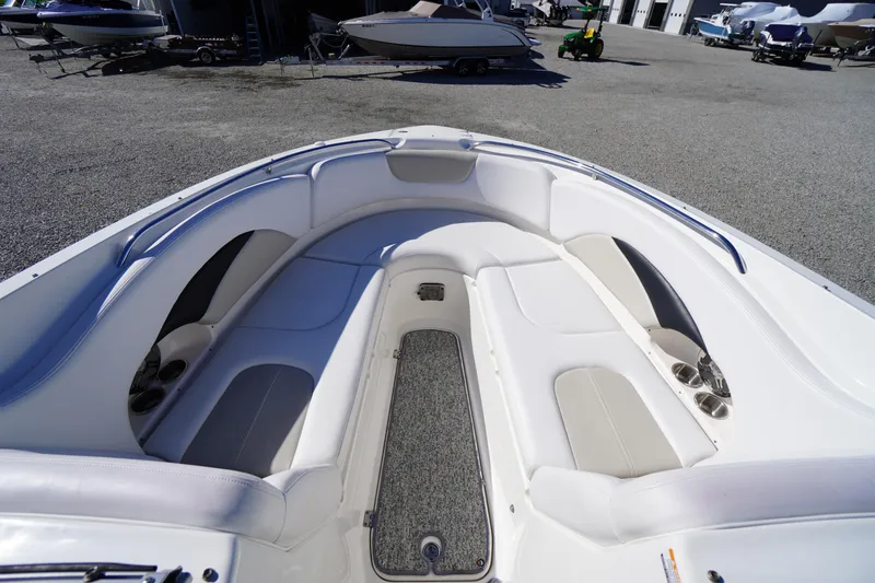 Slide: The Image of 2014 Chaparral 287 SSX boat interior with spacious seating and cup holders. - 4