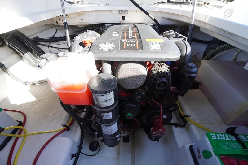 Slide: The Image of 2014 Chaparral 287 SSX engine compartment with Volvo Penta motor and battery. - 44