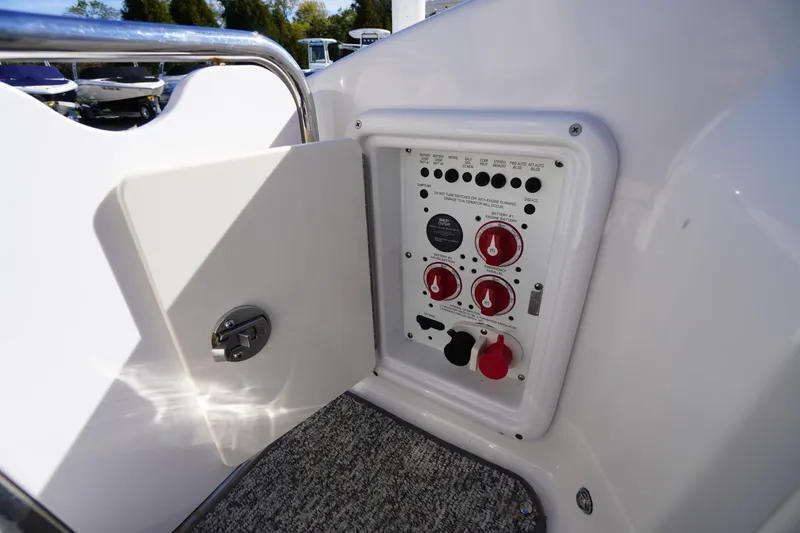 Slide: The Image of Control panel of a 2014 Chaparral 287 SSX boat with open access door. - 46