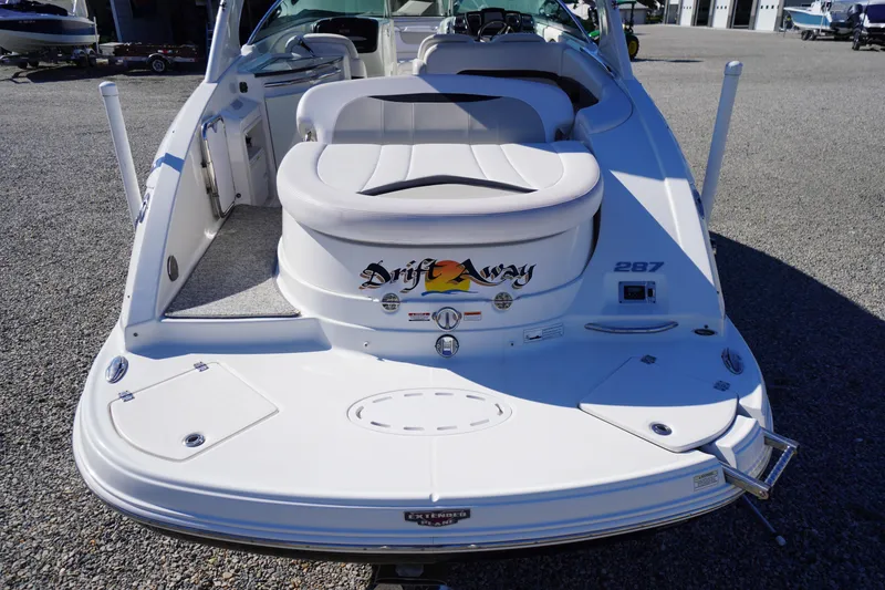 Slide: The Image of 2014 Chaparral 287 SSX boat rear view with seating and "Drift Away" decal. - 50