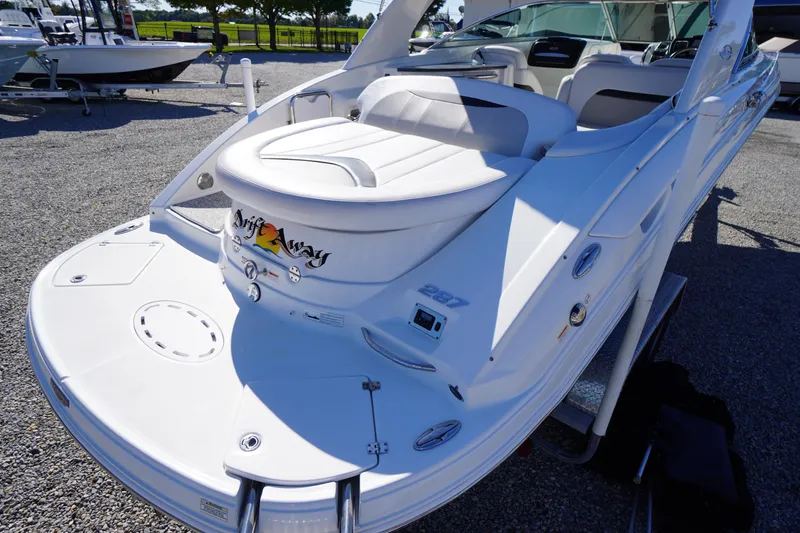 Slide: The Image of 2014 Chaparral 287 SSX boat with sleek white design and comfortable seating. - 53