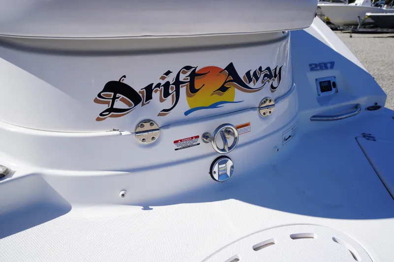 Slide: The Image of 2014 Chaparral 287 SSX boat with "Drift Away" decal on the stern. - 54