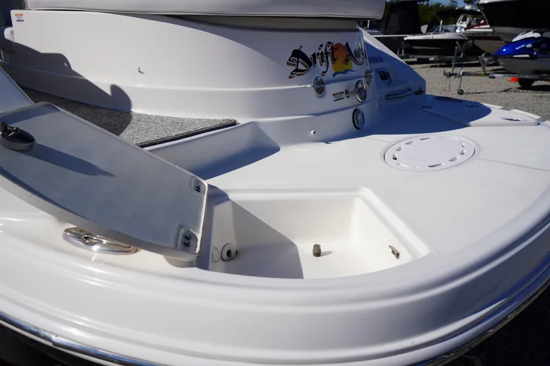 Slide: The Image of 2014 Chaparral 287 SSX boat stern with storage compartments and sleek design. - 56