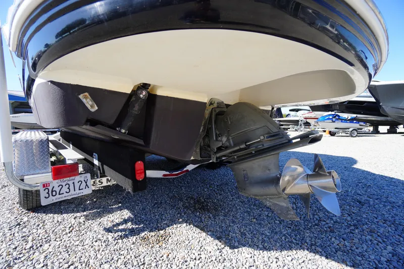 Slide: The Image of 2014 Chaparral 287 SSX boat stern with propeller and Maryland license plate. - 58
