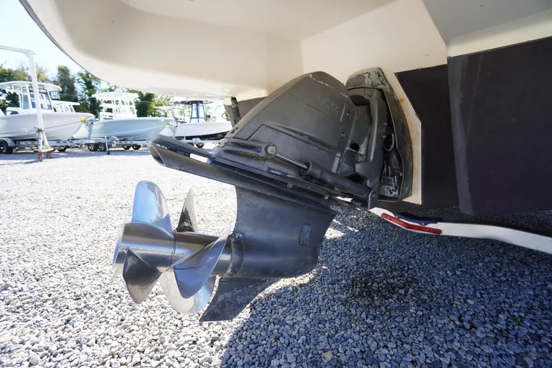 Slide: The Image of Close-up of 2014 Chaparral 287 SSX boat propeller on gravel surface. - 59