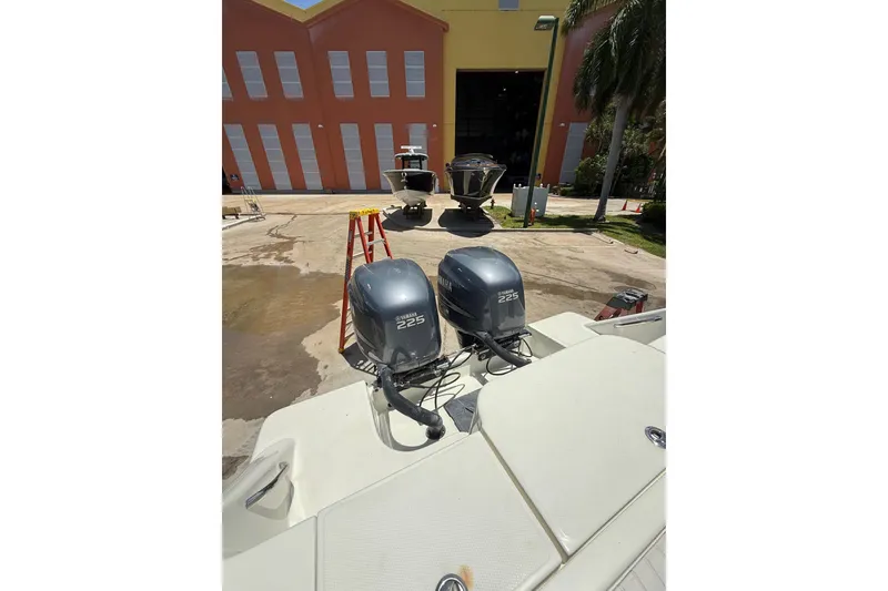 Slide: The Image of 2000 Hydra-Sports 2500 CC boat with twin Yamaha 225 engines at a marina. - 14