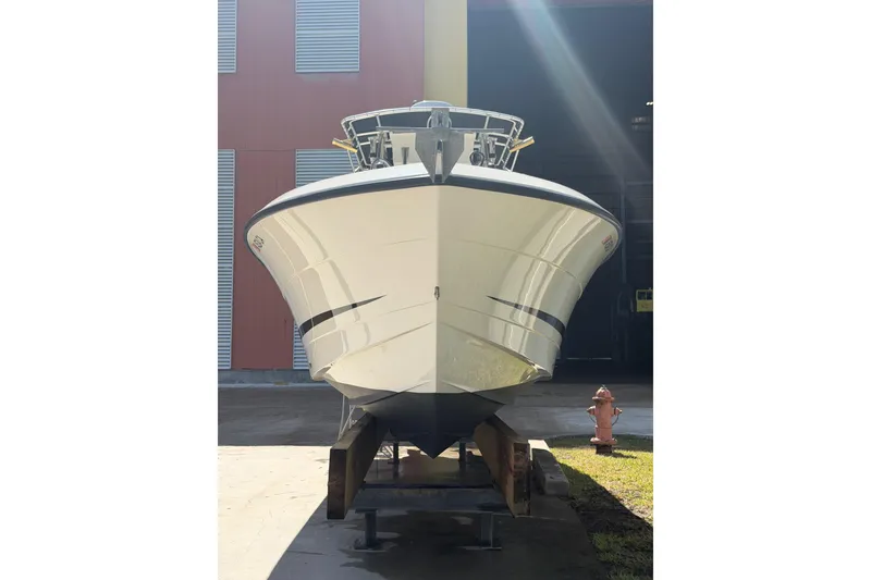 Slide: The Image of 2000 Hydra-Sports 2500 CC boat on stand, front view, in sunlight. - 3