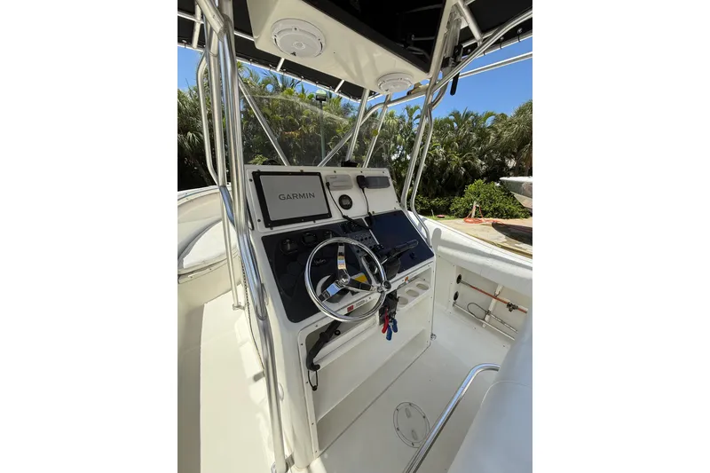 Slide: The Image of 2000 Hydra-Sports 2500 CC boat console with Garmin navigation system and steering wheel. - 4