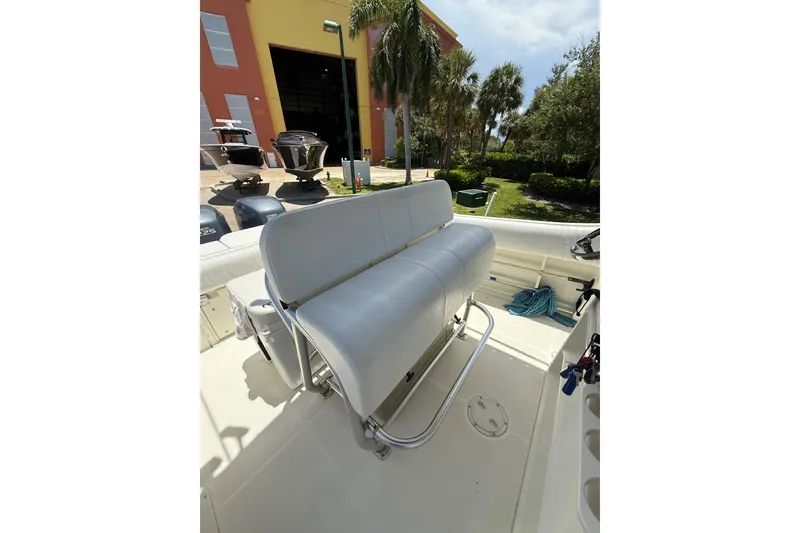 Slide: The Image of 2000 Hydra-Sports 2500 CC boat interior with cushioned seating and outdoor view. - 6