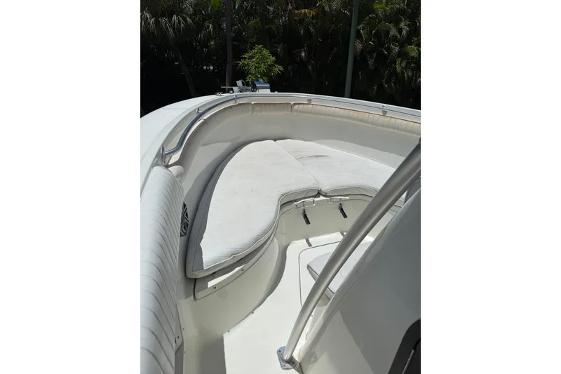 Slide: The Image of 2000 Hydra-Sports 2500 CC boat interior with cushioned seating and railing. - 8